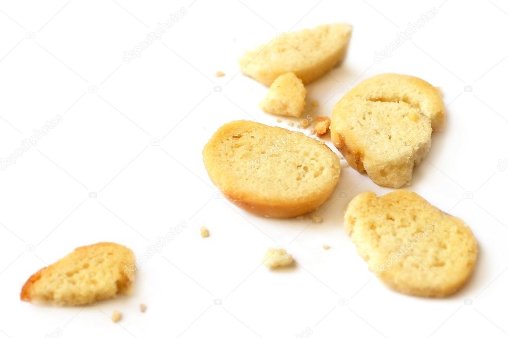 Bread and crumbs on white background