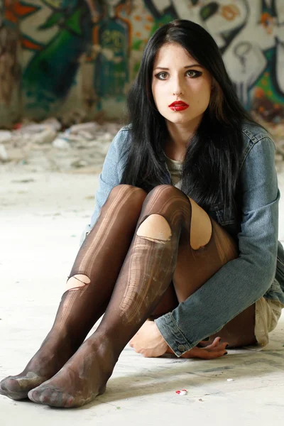 Girl in torn tights - bad education — Stock Photo, Image