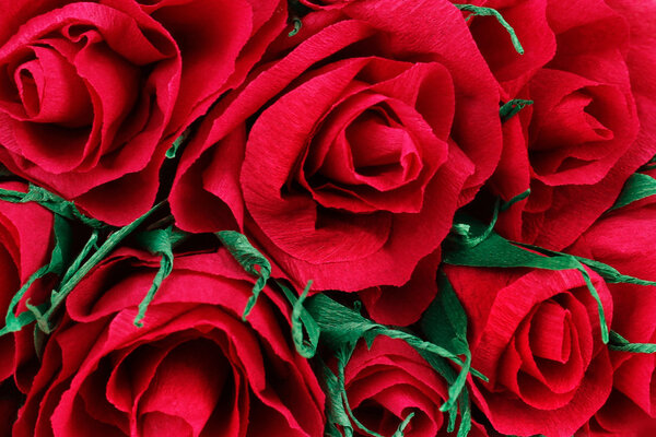 Paper red roses closeup use as background