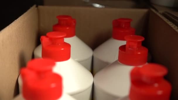 Cosmetic spray packaging at a store warehouse. Wholesale trade in lotions, cosmetics for hygiene. selective focus — Stock Video