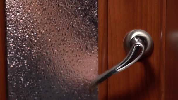 Someone is Trying to Enter the Room. The Door Handle Twitches Several Times — Stock Video