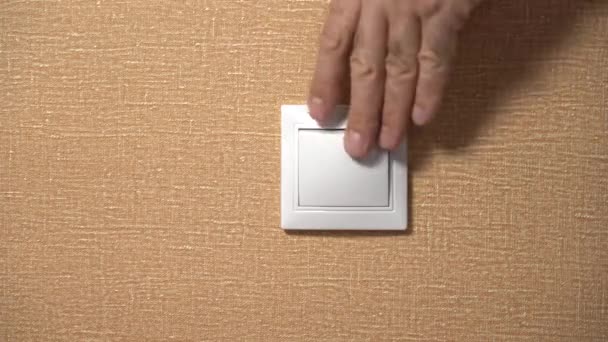 Hand Elderly Man Turns off and On the Light from the Wall Switch — Stock Video