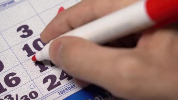Macro shot date of month on calendar circled by red marker. — Stock Video