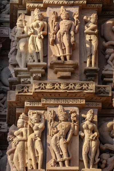 Erotic statues on the exterior walls of the Jian and Hindu Temples at Khajuraho in the Madhya Pradesh region of India. A UNESCO World Heritage Site. Khajuraho has the largest group of medieval Hindu and Jain temples in India.
