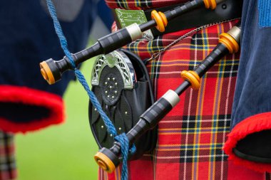 Piper at the Cowal Gathering Highland Games near Dunoon on the Cowal Peninsula, Scotland. clipart