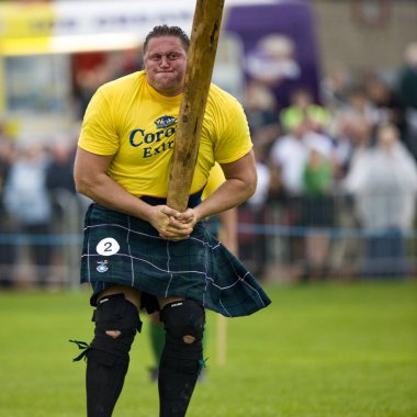 Sportsman about to 'Toss the Caber' at the Cowal Gathering. A traditional Highland Games held each year in Dunoon in Scotland clipart