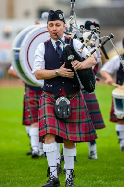 Pipers at the Cowal Gathering Highland Games near Dunoon on the Cowal Peninsula, Scotland. clipart