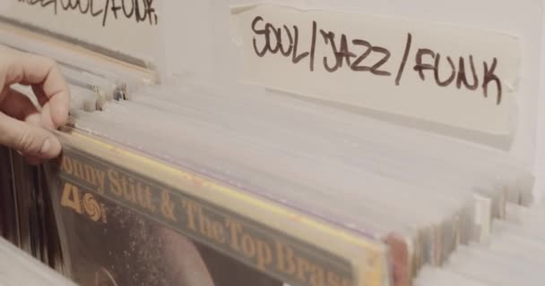 Man Browsing Vinyl Collection Jazz Soul Funk Records Music Store — Vídeo de Stock