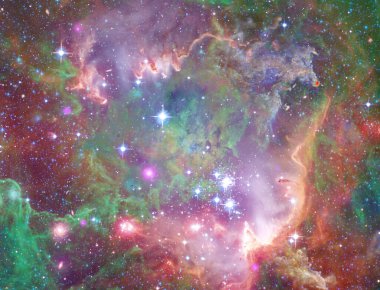 ESA 'nın Herschel Uzay Gözlemevi' nden gelen bu görüntü Rosette nebulasının bir parçasını gösteriyor. Dünya 'dan 5.000 ışık yılı uzaklıkta, tek boynuzlu at takımyıldızında..