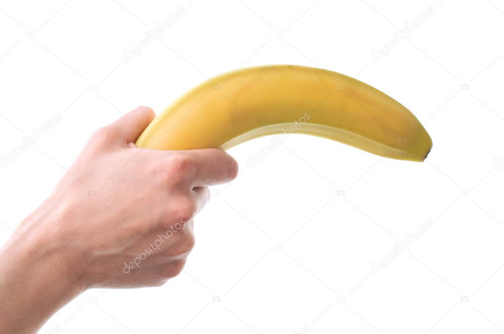 Woman's hand holding a banana on a white background