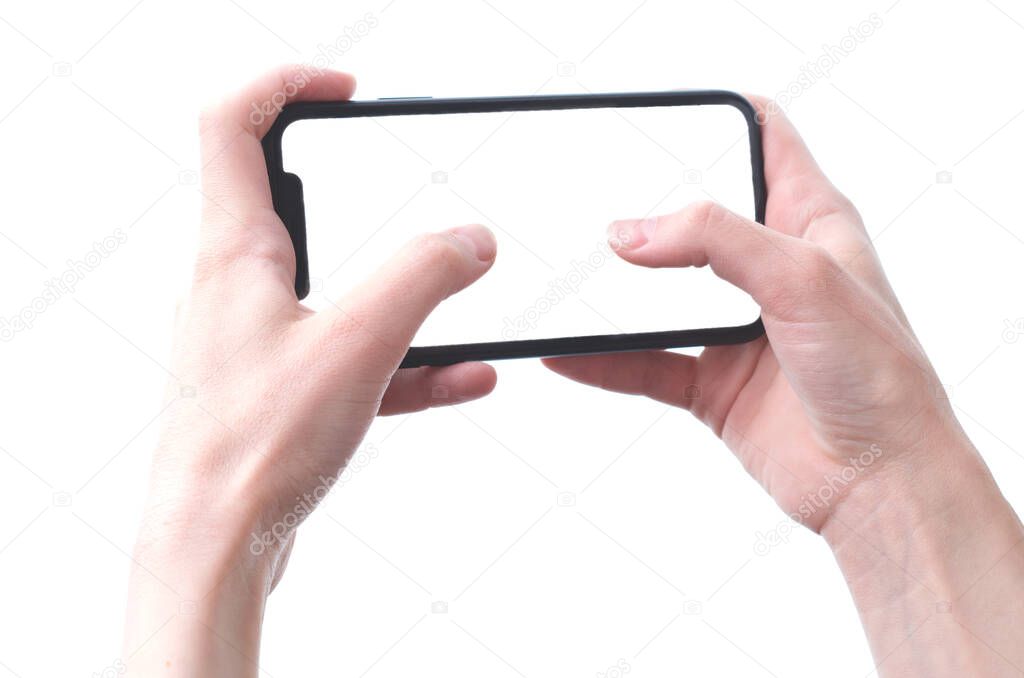 Women's hands hold a smartphone with copy space.Horizontal photo.Women's hands hold a smartphone with copy space.Horizontal photo.Isolated on a white background.