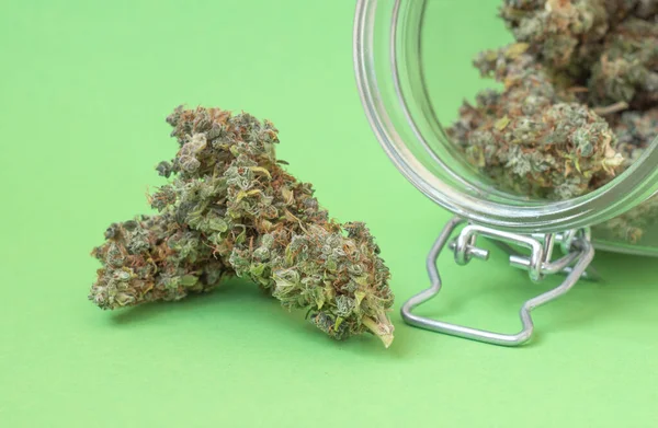 Dry Buds Marijuana Glass Jar Close Green Background — Stock Photo, Image