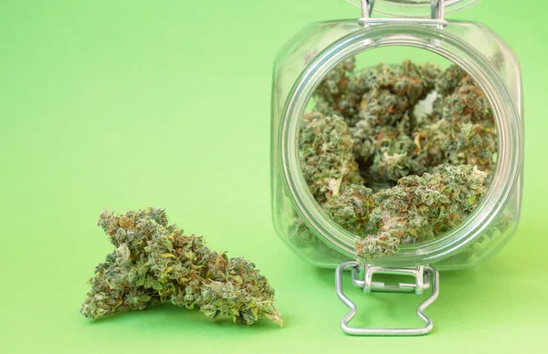 Dry Buds Marijuana Glass Jar Close Green Background — Stock Photo, Image