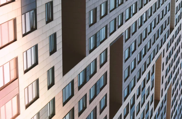 Facade of a modern building.Background with rows of glass windows.