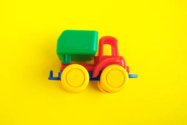 yellow toy car on background.