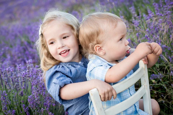 Happy little brother and sister playing — Stock Photo, Image