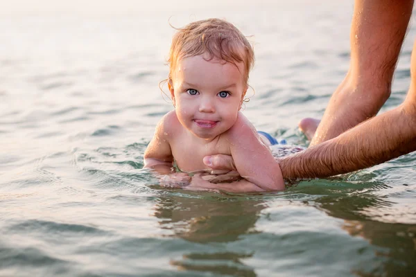 Toddler boy having fun in the hands — Stock Photo, Image