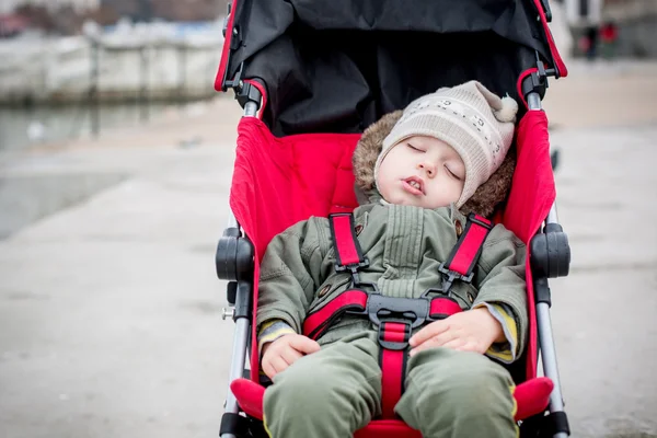 Toddler child is sleeping in the stroller — Stock Photo, Image
