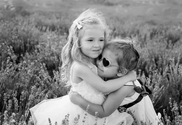 Two little girls hugging — Stock Photo, Image