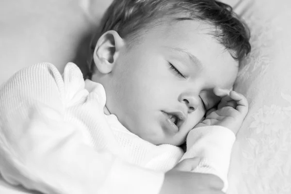 Toddler boy sweetly asleep on a pillow — Stock Photo, Image