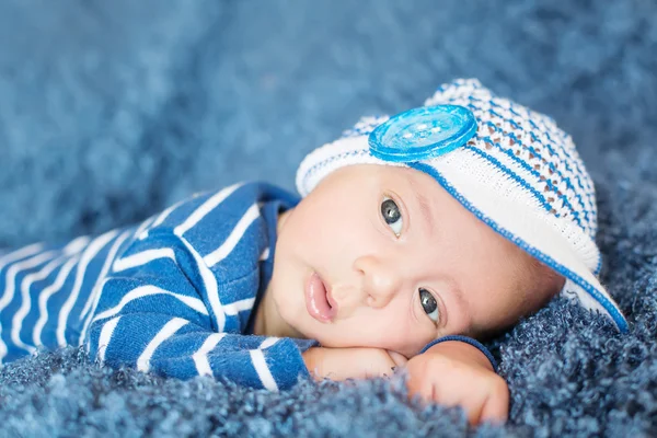 Cute newborn baby in knitted cap — Stock Photo, Image