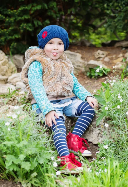 Funny little girl showing tongue — Stock Photo, Image