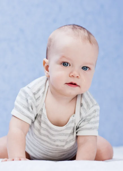 Portrait of a cute sad baby boy Stock Image