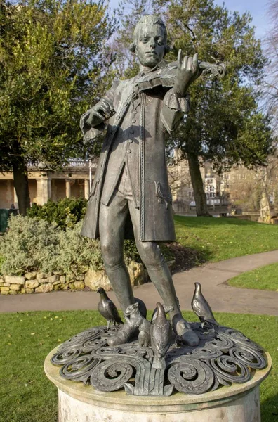 Young Mozart Statue Park Cloudy Sky Background — Stock Photo, Image