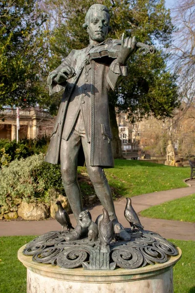 Young Mozart Statue Park Cloudy Sky Background — Stock Photo, Image