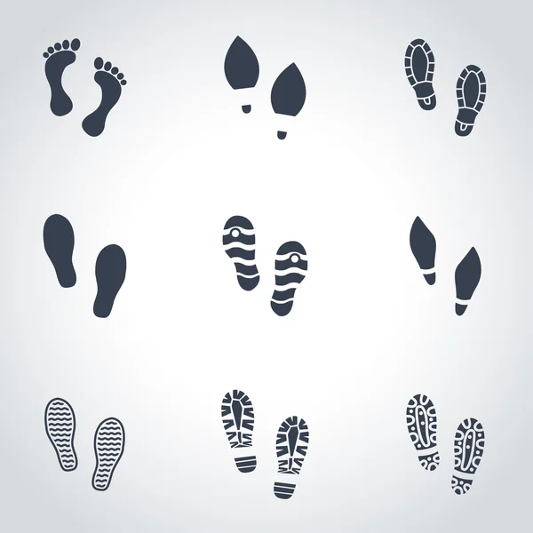 Vector black shoes imprints icon set — Stock Vector