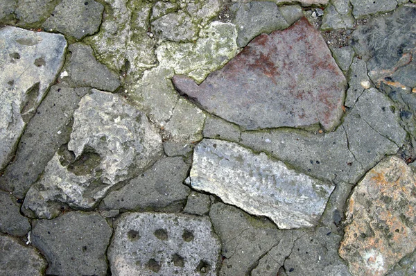 Close up of weathered and pitted grey limestone for backgrounds — Stock Photo, Image