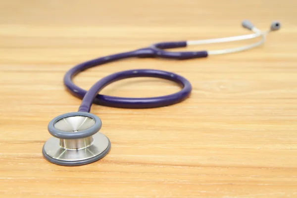 Stethoscope on wooden background — Stock Photo, Image