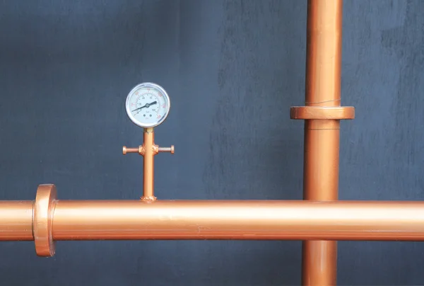 Pressure gauge meter installed on copper pipes — Stock Photo, Image