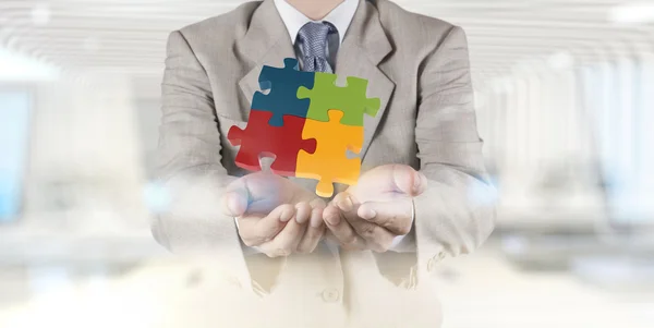 Hand showing 3d puzzle as concept — Stock Photo, Image