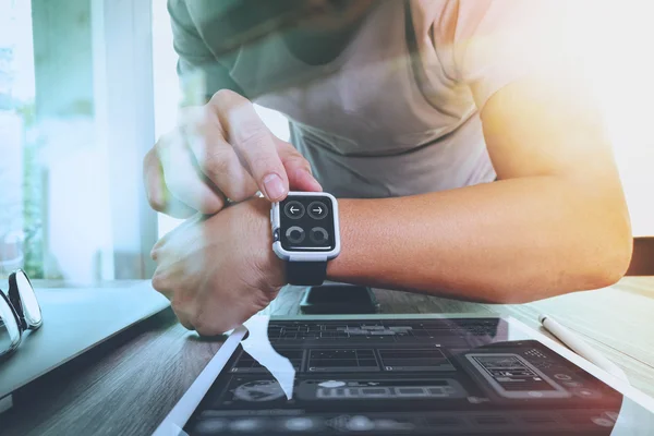 Website designer working with smart watch and digital tablet and — Stock Photo, Image