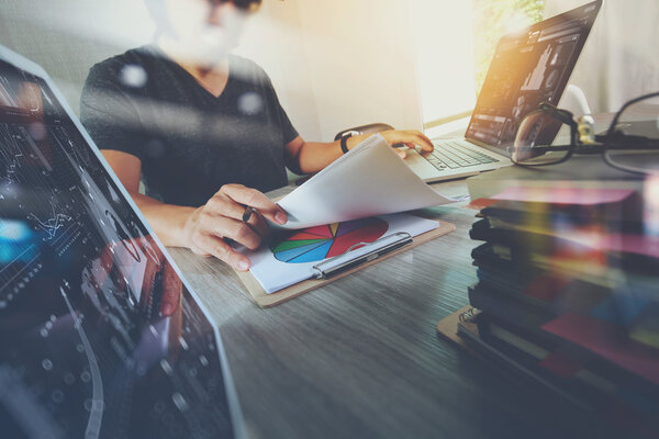 business documents on office table with smart phone and digital 