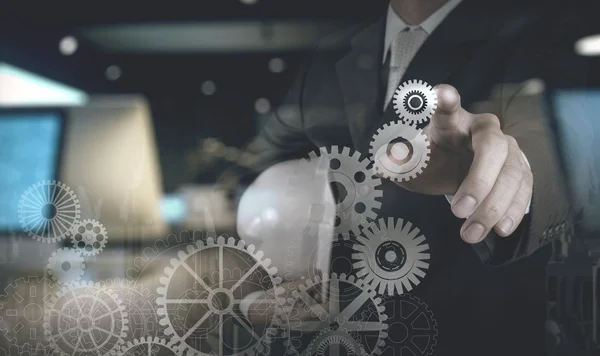 Double exposure of businessman working with blue light gear to s — Stock Photo, Image