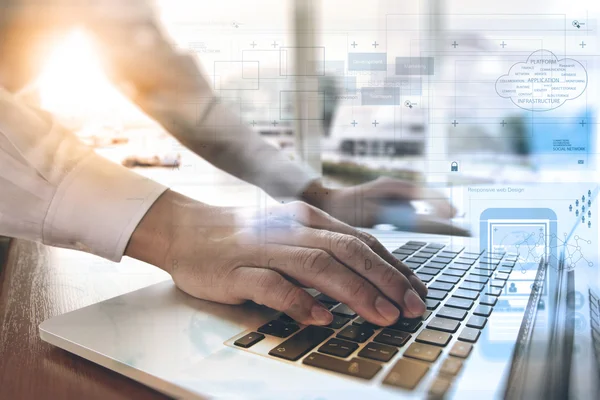 Designer moving hands working with laptop computer and digital w — Stockfoto