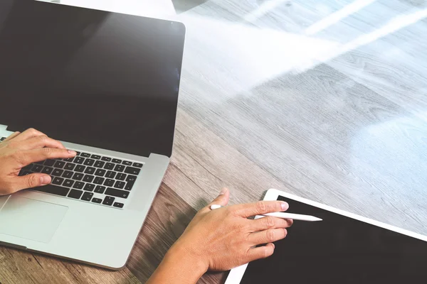 Designer hand working with digital tablet and laptop computer — Stock Photo, Image