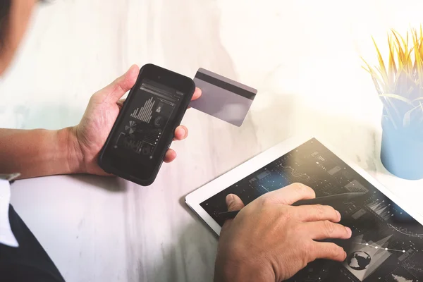 Businessman hands holding plastic credit card and using digital — Stock Photo, Image