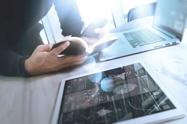 Businessman hand holding book and digital tablet.Photo finance m — Stock Photo, Image