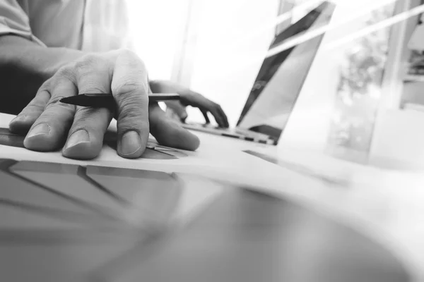 Business man hand working on laptop computer with digital layer — Stock Photo, Image