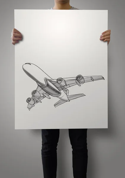 Mann zeigt handgezeichnetes Flugzeug auf Plakatpapier-Hintergrund — Stockfoto