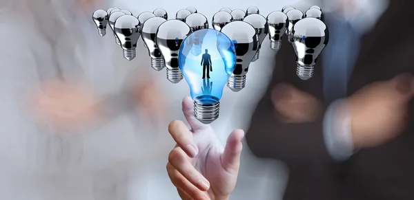 Hand reach 3d light bulb of leadership concept — Stock Photo, Image