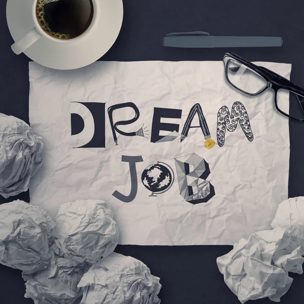 Hand drawn design words DREAM JOB on crumpled paper background a — Stock Photo, Image