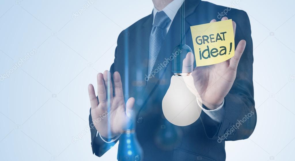 Double exposure of Businessman hand working with 3d light bulb a