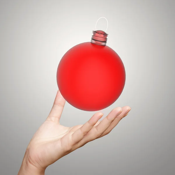 Hand showing  Christmas ornament — Stock Photo, Image