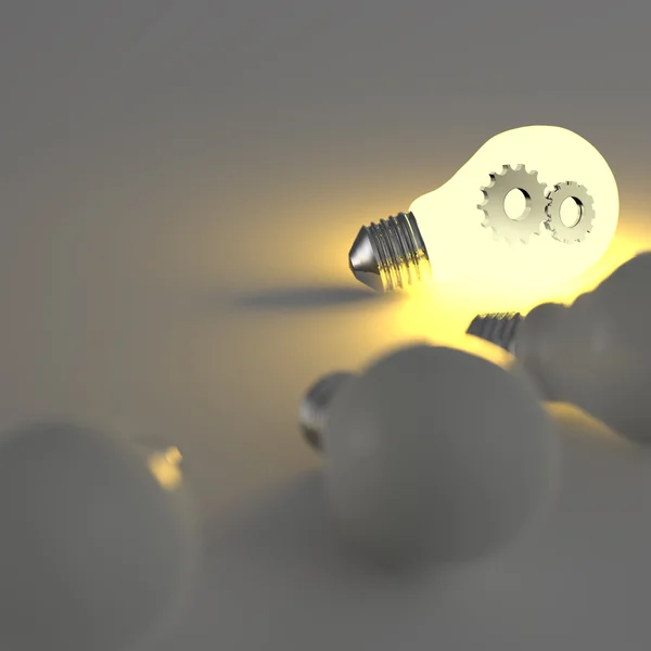 Lamp met versnellingen als concept — Stockfoto