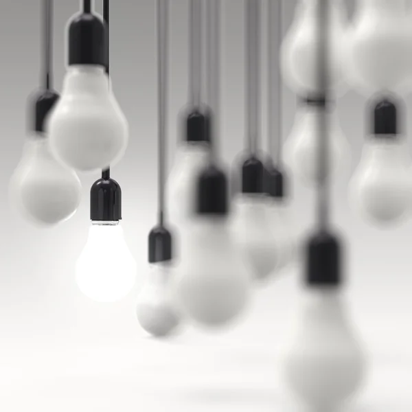 Creative idea and leadership concept light bulb on grey — Stock Photo, Image