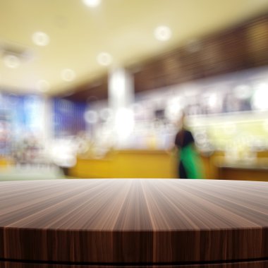 Empty wooden round table and blurred background for product pres clipart
